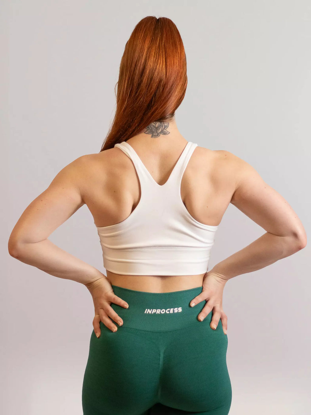 Brassière de sport emblem blanc de dos 