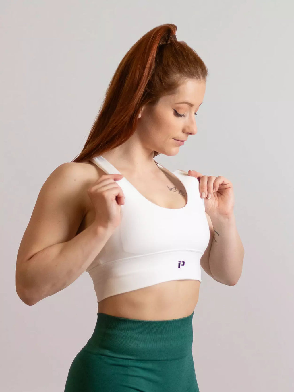 Brassière de sport emblem blanche de profil 