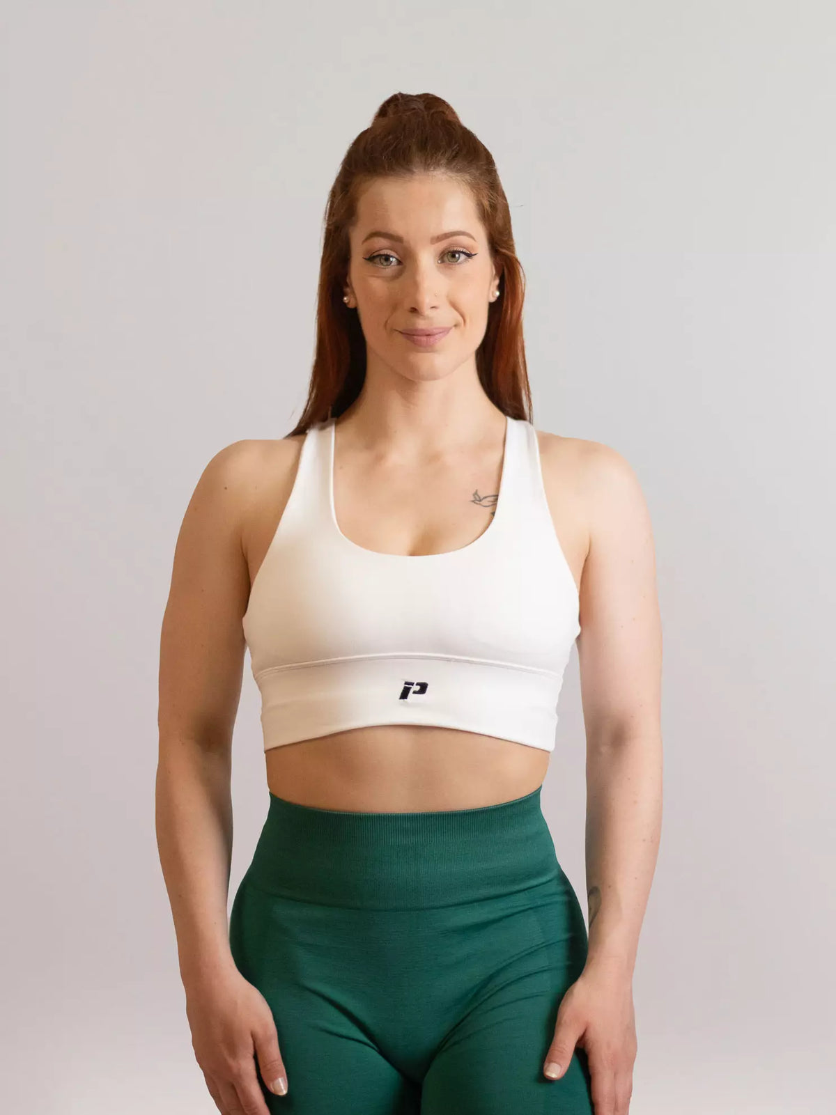 Brassière de sport emblem blanc de face 