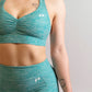 brassière de sport bleu turquoise pour femme zoom sur les logos en silicone inprocess