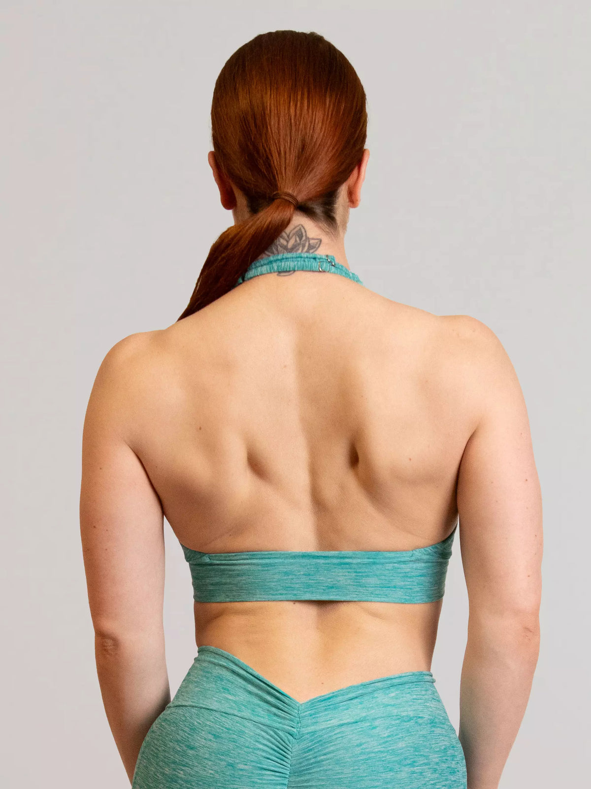 brassière de sport bleu turquoise pour femme de dos