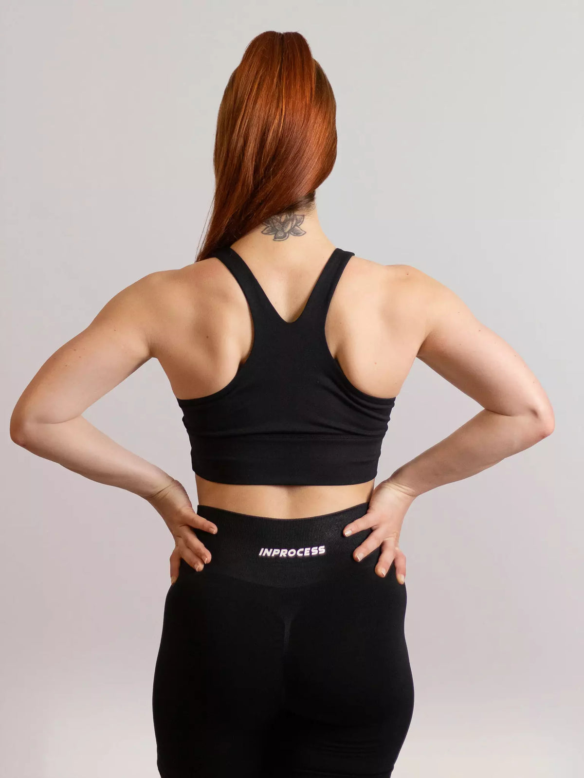 brassière de sport emblem noir de dos 