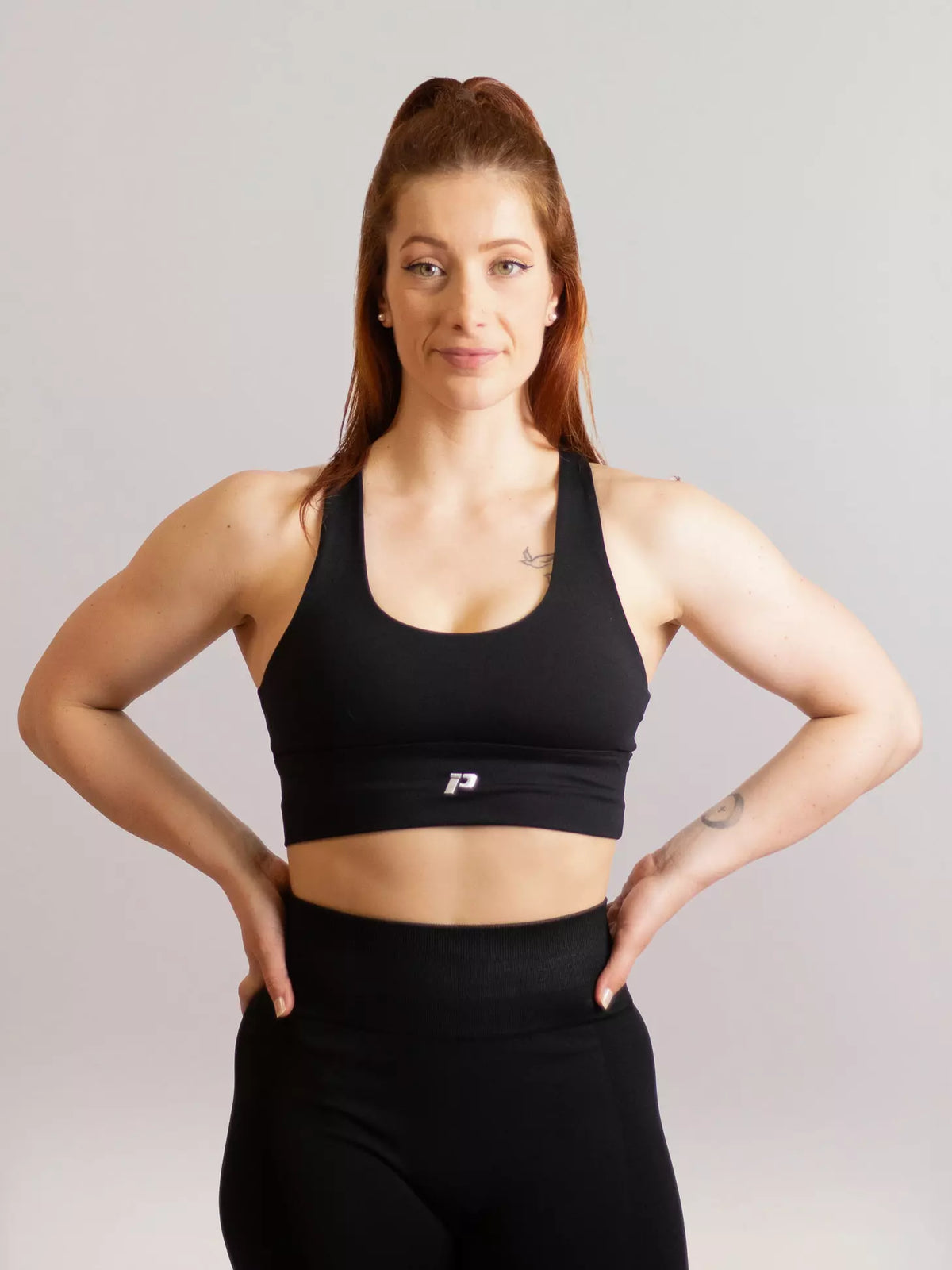 Brassière de sport emblem noir de face 