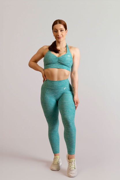 Mannequin portant la brassière et le legging bleu turquoise de chez InProcess