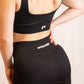Ensemble de sport cotelé RIB noir de profil gauche zoom logo