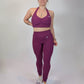 Ensemble de sport violet sculptine de face 
