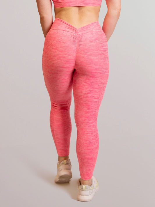 Mannequin de dos portant le legging rose de chez InProcess